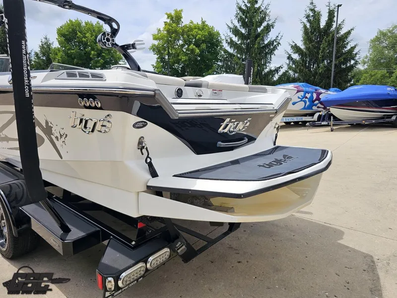 Slide: The Image of 2014 Tigé Z3 boat on trailer, rear view, parked outdoors. - 30