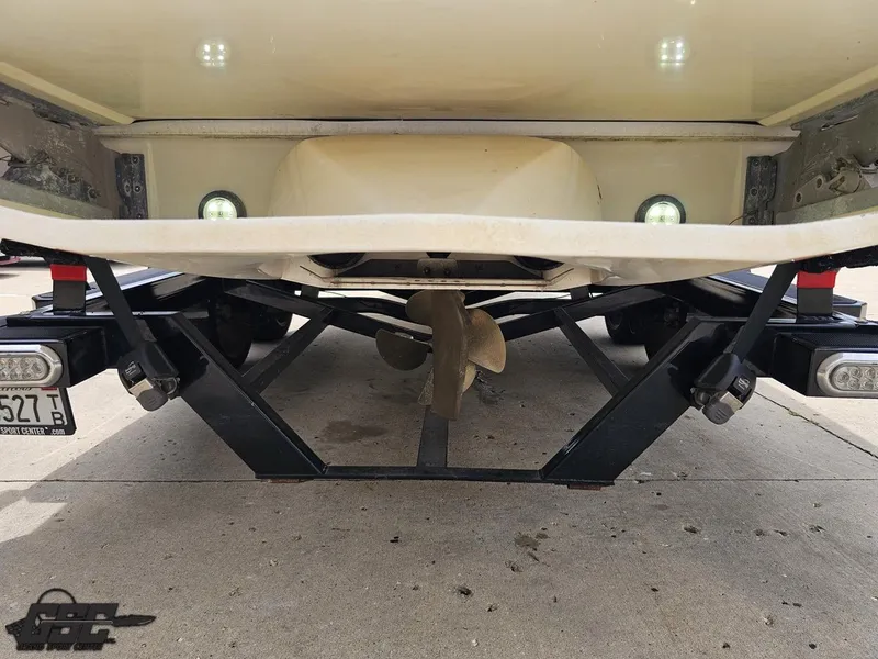 Slide: The Image of 2014 Tigé Z3 boat on trailer, showing propeller and rear lights. - 34