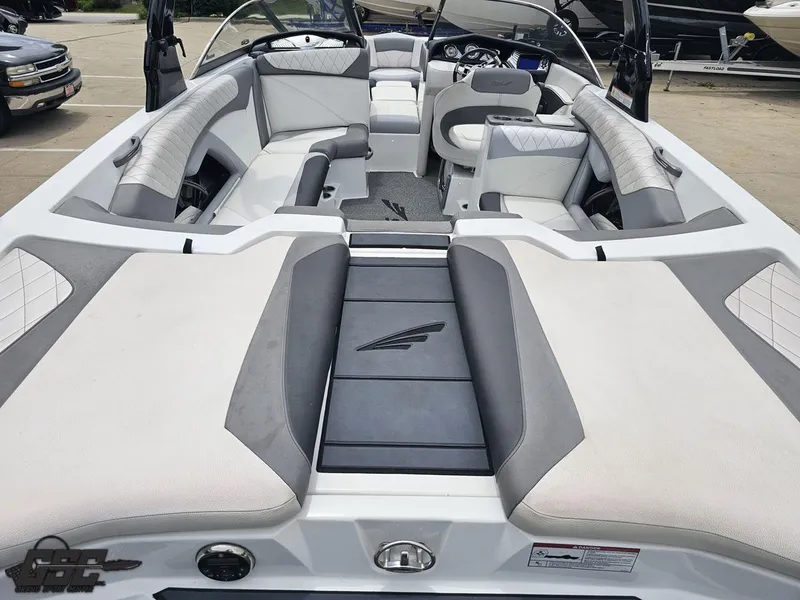 Slide: The Image of 2014 Tigé Z3 boat interior with white and gray seating, sleek design. - 37