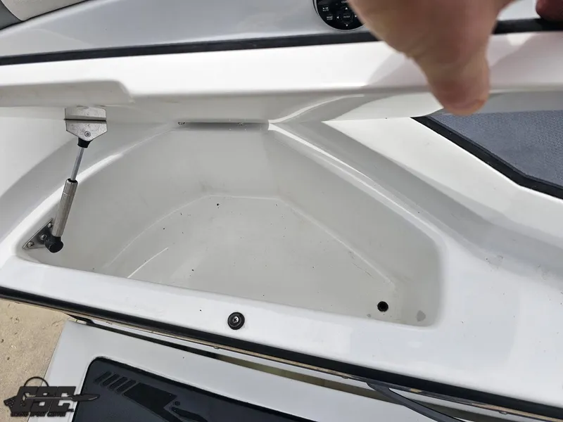 Slide: The Image of Open storage compartment in 2014 Tigé Z3 boat, showcasing interior space. - 39