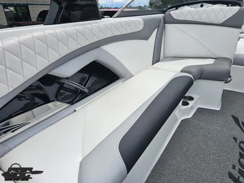 Slide: The Image of 2014 Tigé Z3 boat interior with white and gray seating, diamond stitching, and cup holders. - 47