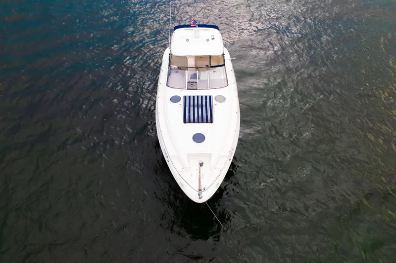 Slide: The Image of Top view of a 2004 Regal 4260 Commodore yacht on water. - 5