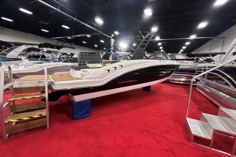 Slide: The Image of 2026 Chaparral 23 SSi boat displayed indoors on red carpet. - 3