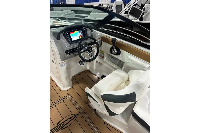 Slide: The Image of 2026 Chaparral 23 SSi boat interior with modern dashboard and steering wheel. - 8