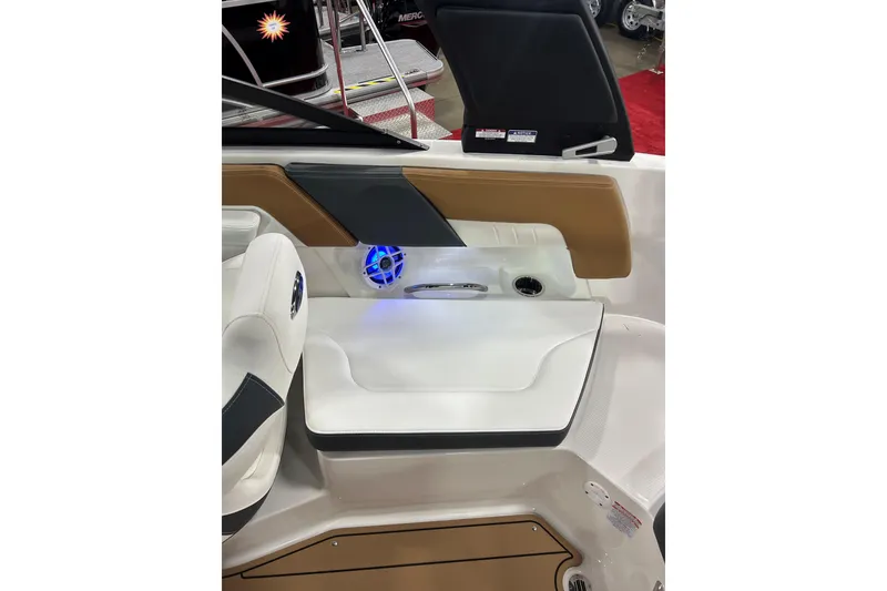 Slide: The Image of Interior of 2026 Chaparral 23 SSi boat with stylish seating and speaker system. - 9