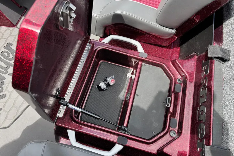 Slide: The Image of 2025 Ranger Z519R boat storage compartment with open lid and interior view. - 9