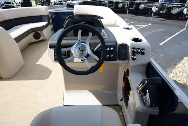 Slide: The Image of 2026 Harris Cruiser 230 boat interior with steering wheel and control panel. - 12