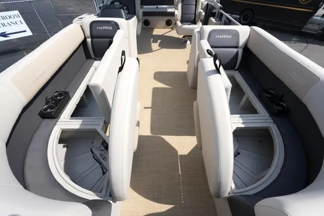 Slide: The Image of 2026 Harris Cruiser 230 interior with spacious seating and cup holders. - 9