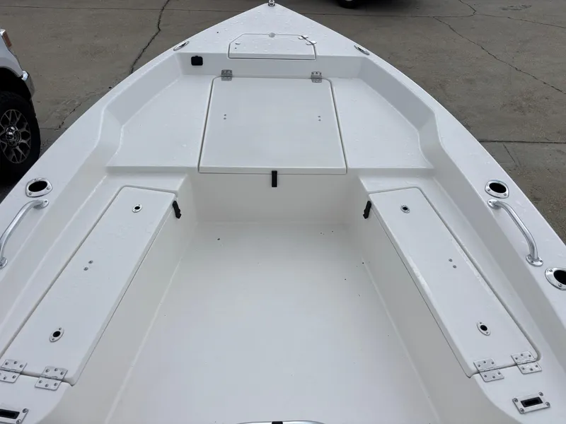 Slide: The Image of 2026 Bay Rider 239 Bay boat deck with storage compartments and handles. - 18