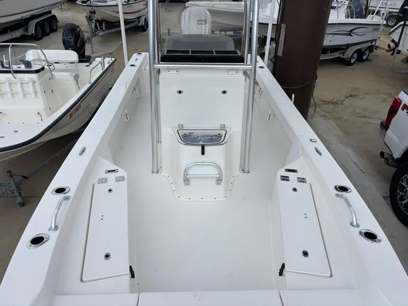 Slide: The Image of 2026 Bay Rider 239 Bay boat interior, featuring spacious deck and storage compartments. - 22