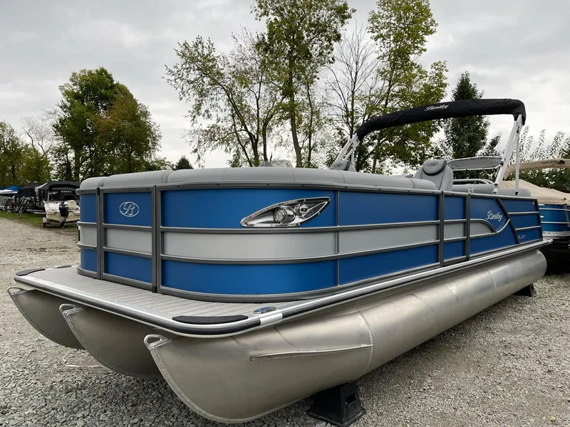The Image of 2025 Bentley Pontoons Legacy 243 QSB, blue and silver pontoon boat, parked outdoors. - 0