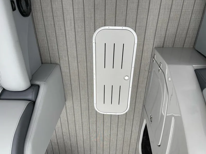 Slide: The Image of Interior of 2025 Bentley Pontoons Legacy 243 QSB, featuring sleek seating and storage. - 16