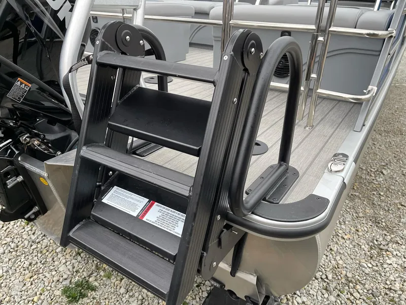 Slide: The Image of 2025 Bentley Pontoons Legacy 243 QSB with boarding ladder on deck. - 2
