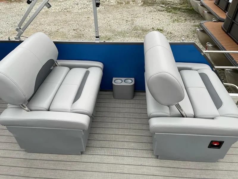 Slide: The Image of 2025 Bentley Pontoons Legacy 243 QSB interior with gray seating and cup holders. - 20