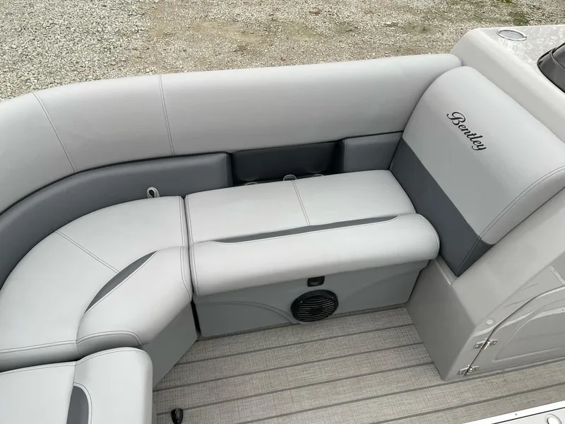 Slide: The Image of 2025 Bentley Pontoons Legacy 243 QSB interior with luxurious gray seating and elegant design. - 5