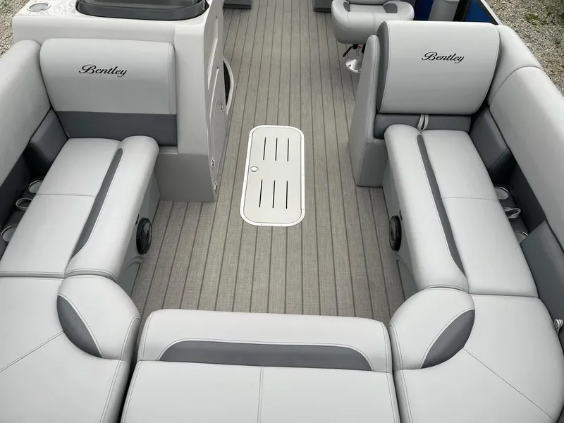 Slide: The Image of 2025 Bentley Pontoons Legacy 243 QSB interior with luxurious gray seating and flooring. - 8