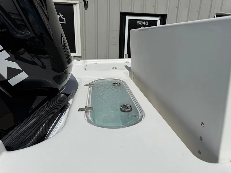 Slide: The Image of 2026 Sea Pro 250 Bay boat detail with engine and deck features. - 11