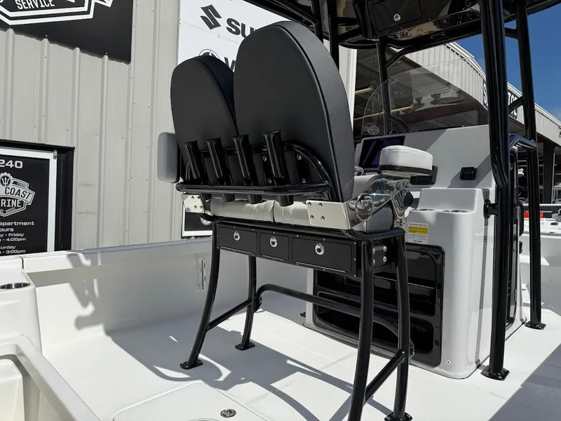 Slide: The Image of 2026 Sea Pro 250 Bay boat interior with seating and storage compartments. - 14