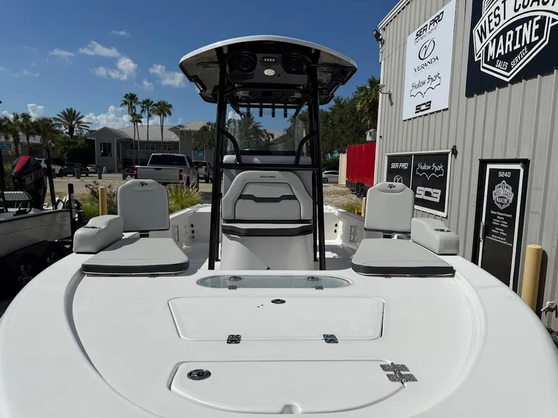 Slide: The Image of 2026 Sea Pro 250 Bay boat at West Coast Marine dealership, sunny day. - 3