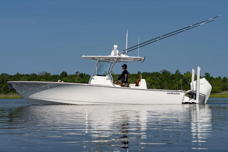 Slide: The Image of 2025 Valhalla Boatworks V-29 Hybrid on calm water, side view. - 3