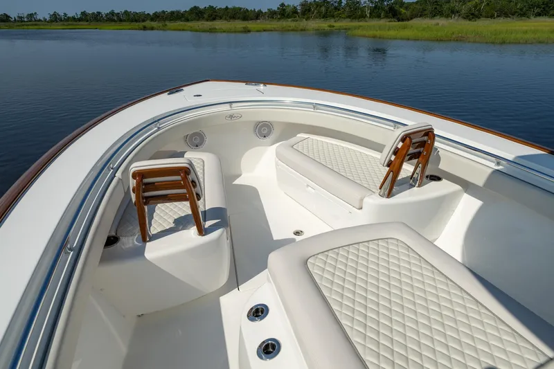 Slide: The Image of 2025 Valhalla Boatworks V-29 Hybrid interior with luxurious seating on calm water. - 6