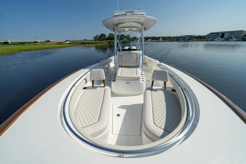 Slide: The Image of 2025 Valhalla Boatworks V-29 Hybrid on calm water, showcasing luxurious seating and sleek design. - 8