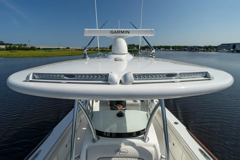 Slide: The Image of Valhalla Boatworks V-29 Hybrid 2025 on water, featuring advanced Garmin navigation system. - 9