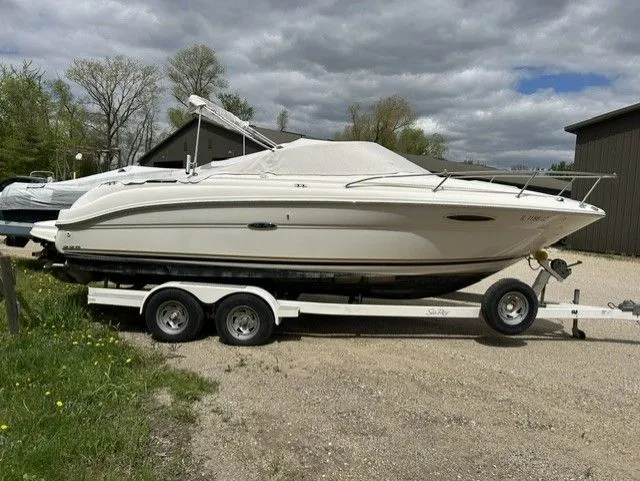 Slide: The Image of 2004 Sea Ray 225 Weekender boat on trailer, side view. - 10