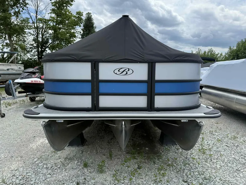 The Image of 2025 Bentley Pontoons 243 Fish-N-Cruise pontoon boat with cover, parked on gravel. - 1