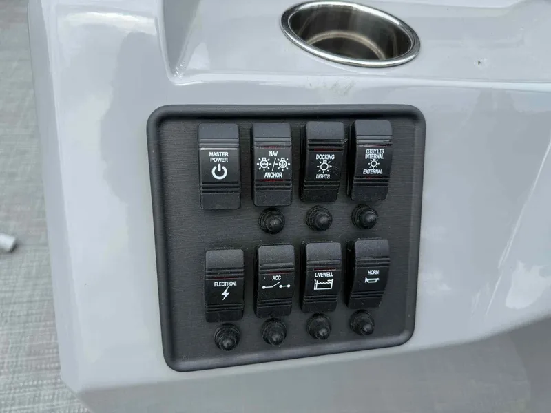 Slide: The Image of Control panel of 2025 Bentley Pontoons 243 Fish-N-Cruise with various switches. - 10