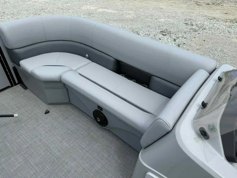 Slide: The Image of 2025 Bentley Pontoons 243 Fish-N-Cruise interior with gray seating and modern design. - 12