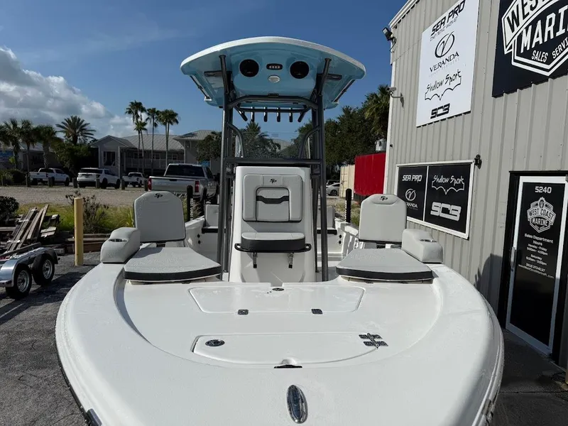 Slide: The Image of 2026 Sea Pro 230 Bay boat at West Coast Marine dealership, sunny day. - 4