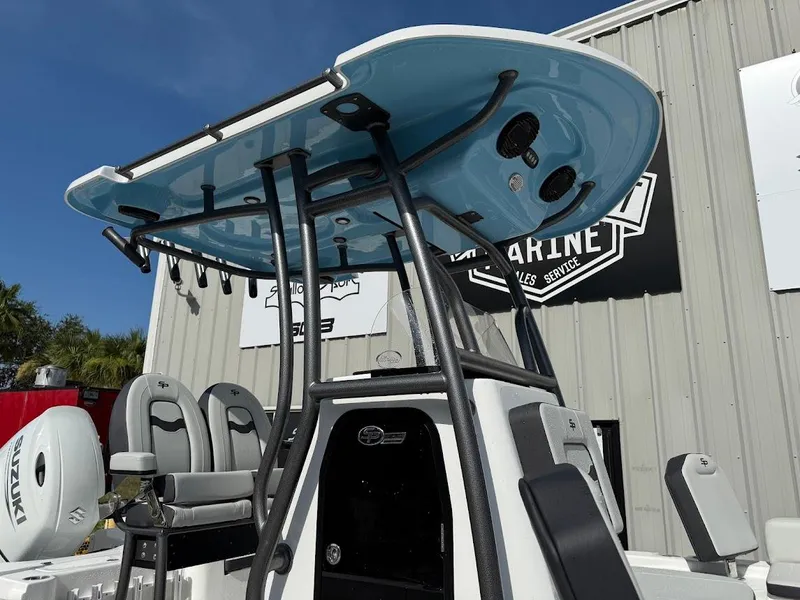 Slide: The Image of 2026 Sea Pro 230 Bay boat with T-top and seating, displayed outdoors. - 7