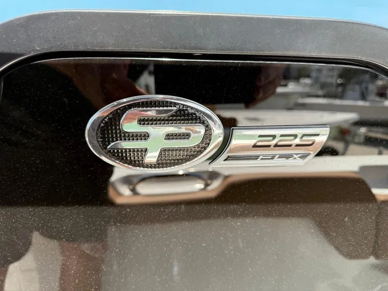 Slide: The Image of 2026 Sea Pro 225 Sandbar boat emblem on a reflective surface. - 13