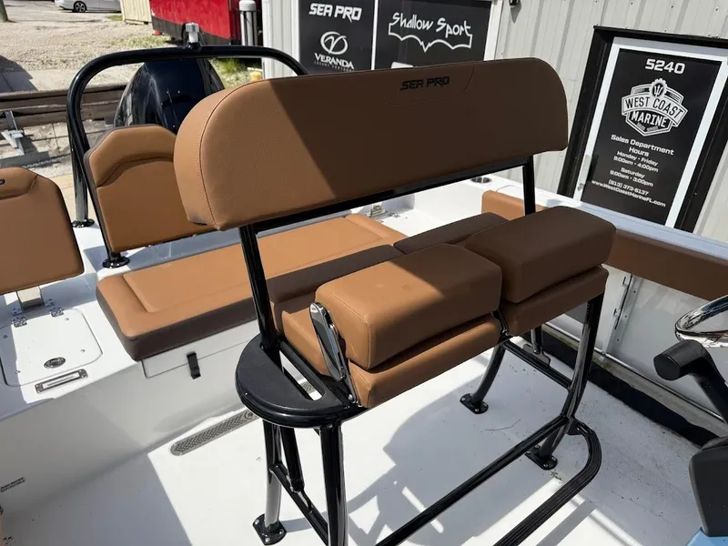 Slide: The Image of 2026 Sea Pro 225 Sandbar boat interior with tan seating and black frame. - 14
