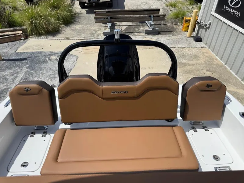 Slide: The Image of 2026 Sea Pro 225 Sandbar boat interior with tan seating and sleek design. - 17