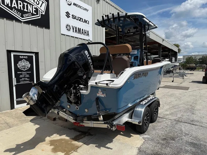 Slide: The Image of 2026 Sea Pro 225 Sandbar boat with Suzuki engine at West Coast Marine dealership. - 6