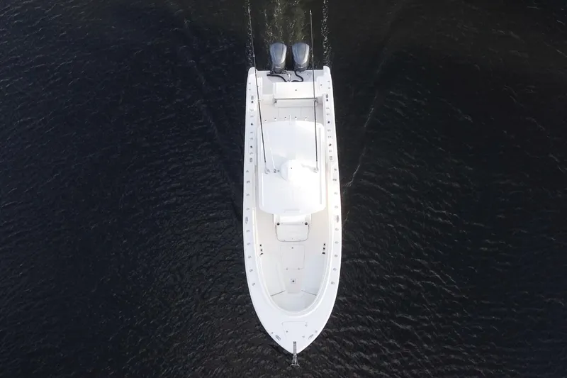 Slide: The Image of Aerial view of 2013 Edgewater 318CC boat on dark water. - 2