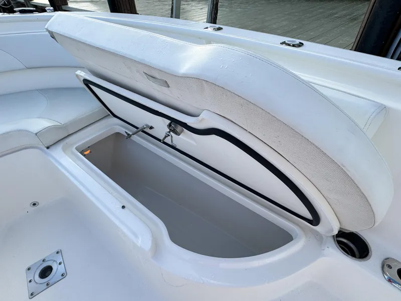 Slide: The Image of Open storage compartment on a 2013 Edgewater 318CC boat, showcasing spacious interior. - 36