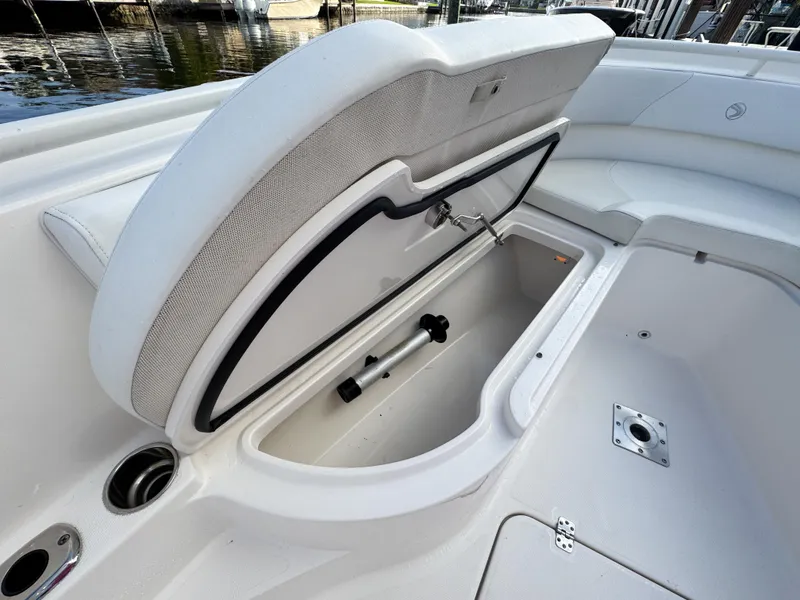 Slide: The Image of Open storage compartment on 2013 Edgewater 318CC boat, showcasing spacious interior design. - 38