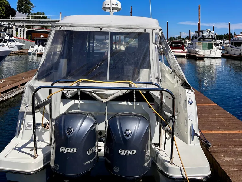 Slide: The Image of 2019 Jeanneau NC 1095 boat docked with twin Yamaha 300 engines. - 4