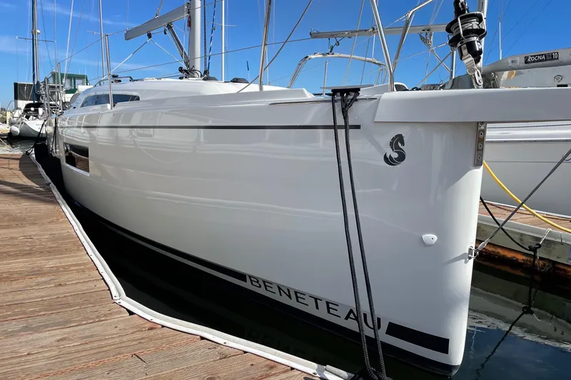 Slide: The Image of 2021 Beneteau Oceanis 30.1 sailboat docked at marina, side view. - 0