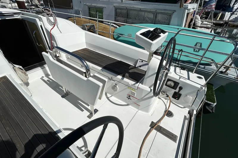 Slide: The Image of Beneteau Oceanis 30.1 yacht cockpit, 2021 model, featuring dual steering wheels and modern controls. - 10