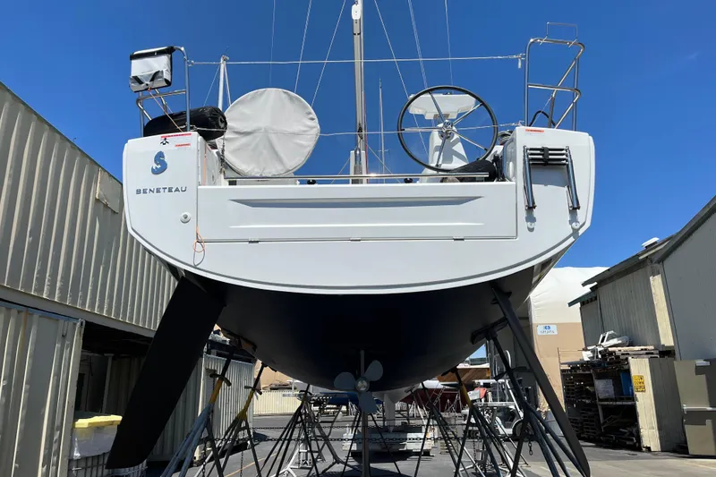 Slide: The Image of Beneteau Oceanis 30.1 sailboat, 2021 model, docked in a marina under clear blue skies. - 16