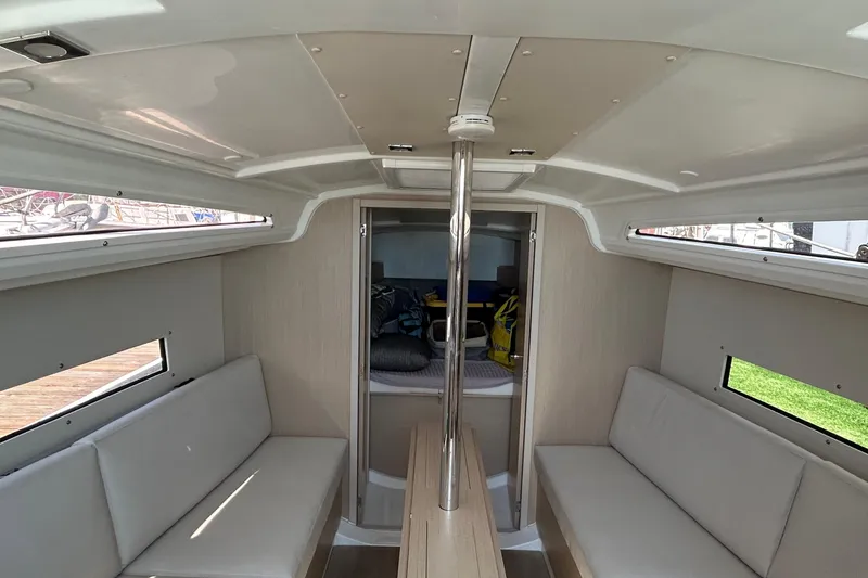 Slide: The Image of Interior of 2021 Beneteau Oceanis 30.1 sailboat, featuring seating and modern design. - 19