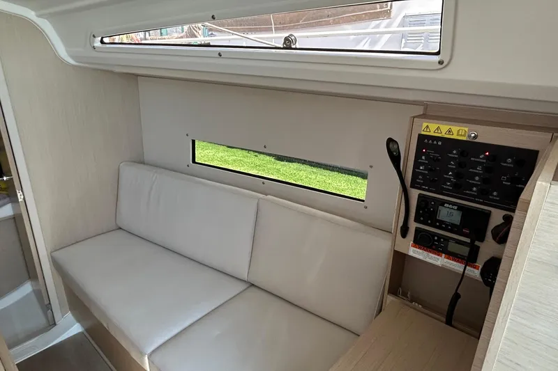 Slide: The Image of Interior of 2021 Beneteau Oceanis 30.1 yacht with seating and control panel. - 22