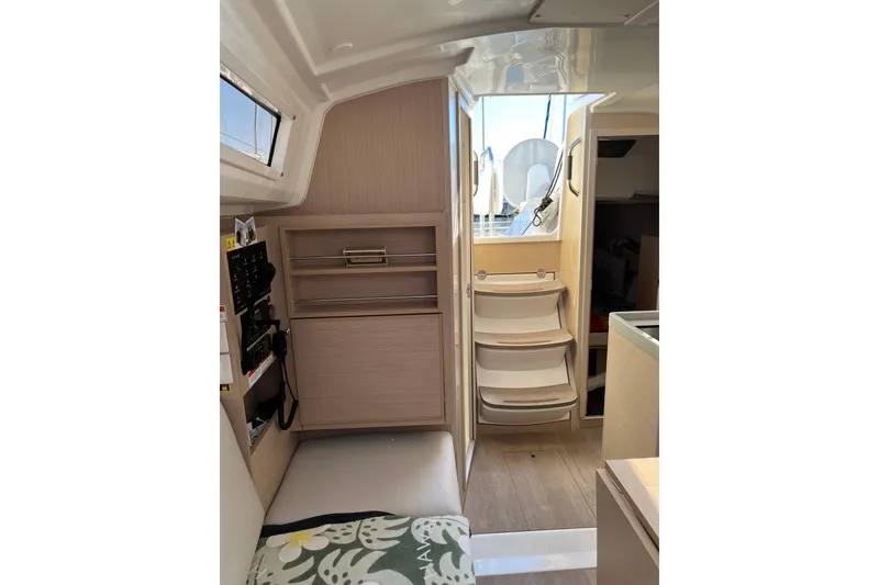Slide: The Image of Interior of 2021 Beneteau Oceanis 30.1 yacht, featuring modern design and compact storage. - 23