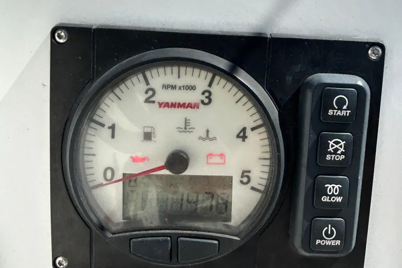 Slide: The Image of Yanmar engine control panel on 2021 Beneteau Oceanis 30.1 sailboat, featuring RPM gauge and buttons. - 9