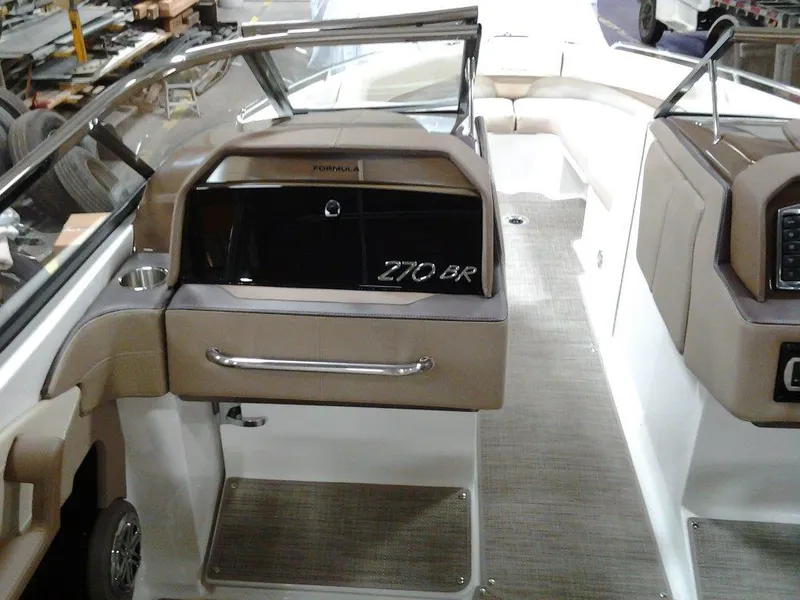 Slide: The Image of 2016 Formula 270 Bowrider interior with seating and dashboard view. - 14