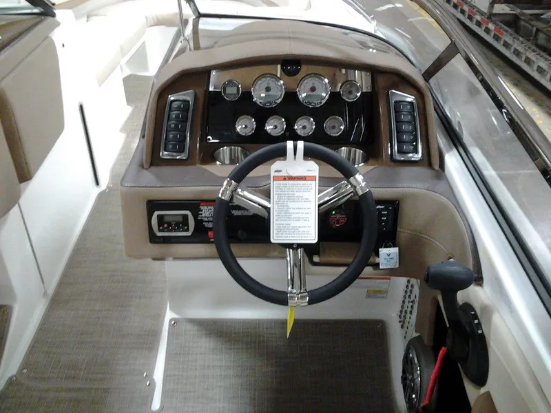 Slide: The Image of 2016 Formula 270 Bowrider dashboard with steering wheel and control panel. - 15